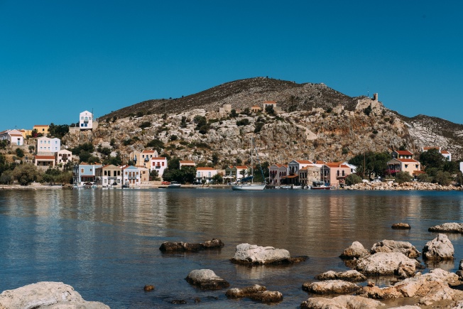 A photo taken from across a bay with a row of houses