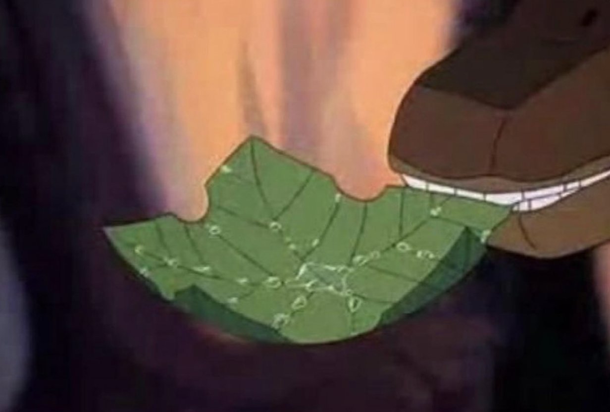 A screencap from the movie 'The Land Before Time' showing a dinosaur eating a 'treestar', which looks exactly like a maple leaf
