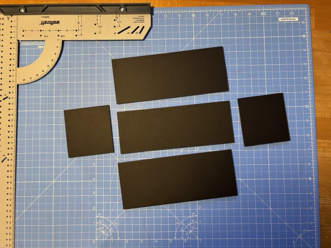 See how the left / right pieces are longer than their corresponding edges on the base?
They’ll go better if you attach the top / bottom pieces to the base first.