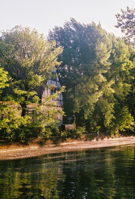 The Old Toll House, and petals on the water.