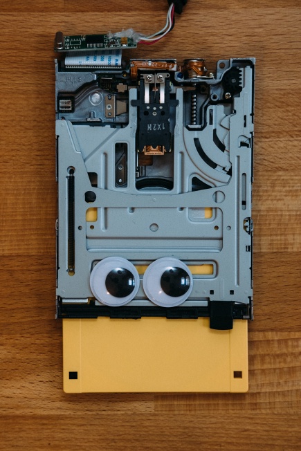 A USB floppy drive with googly eyes